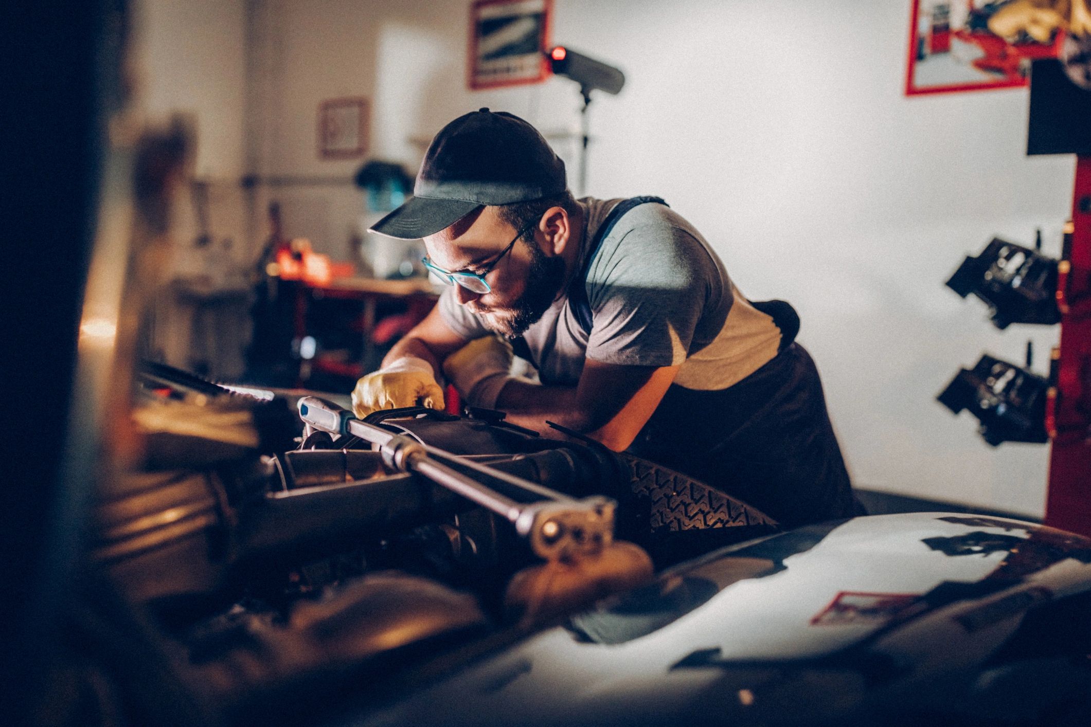 Mechanic inspecting a vehicle in a repair bay