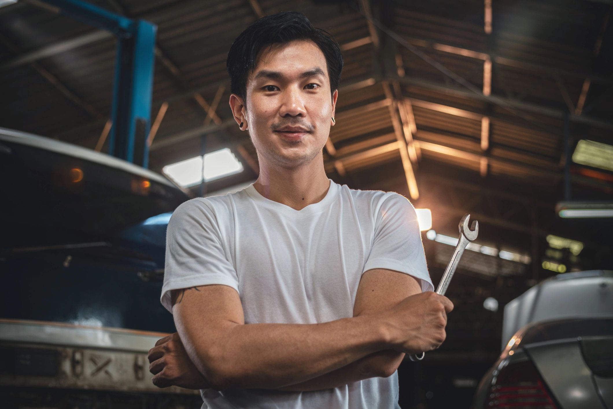 Portrait of confident auto mechanics in auto repair shop