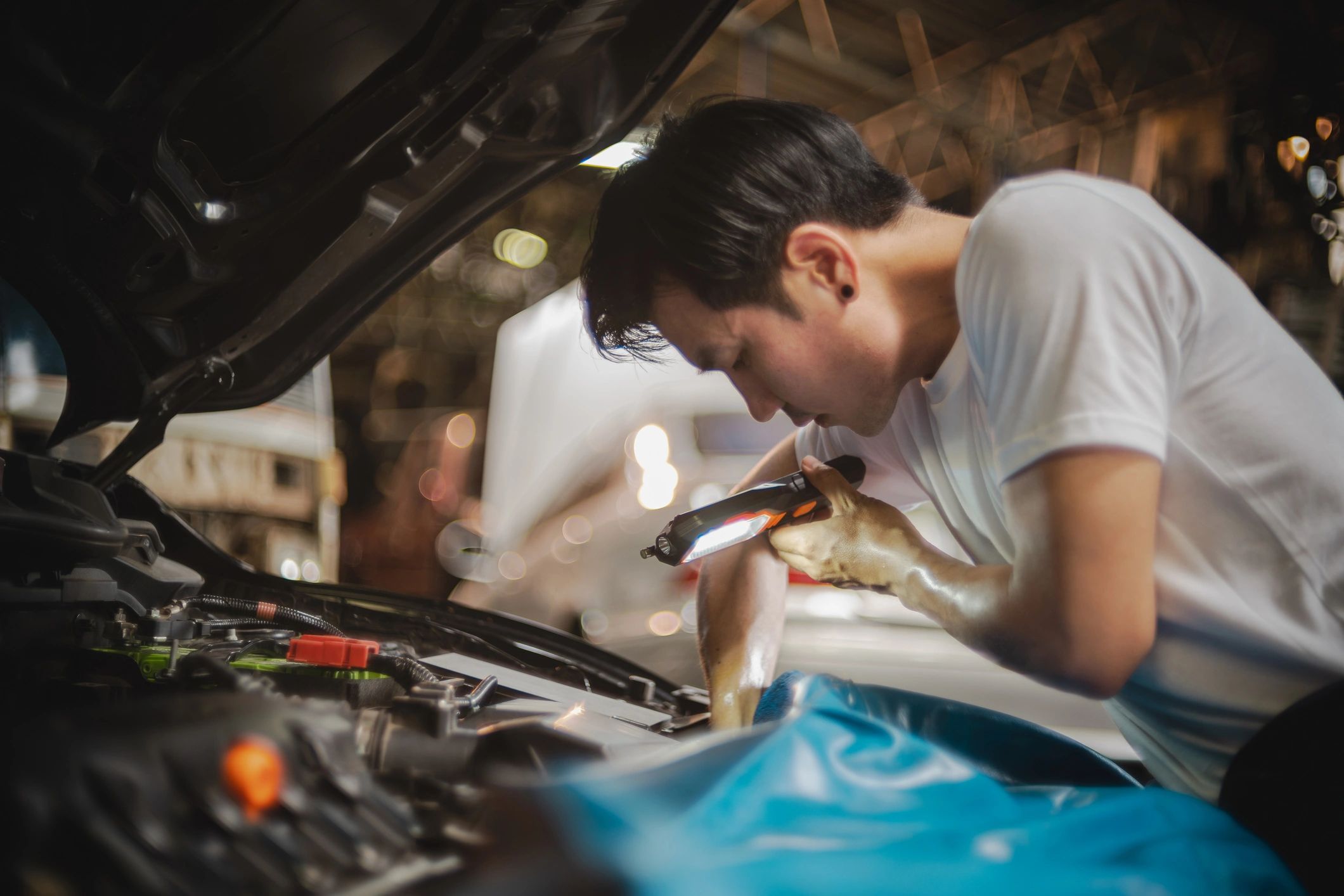 Mechanic examining a car engine