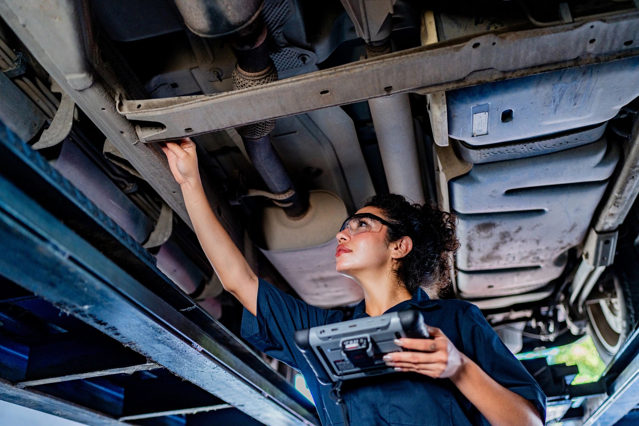 Mechanic performing diagnostics on a Japanese vehicle in a modern repair shop